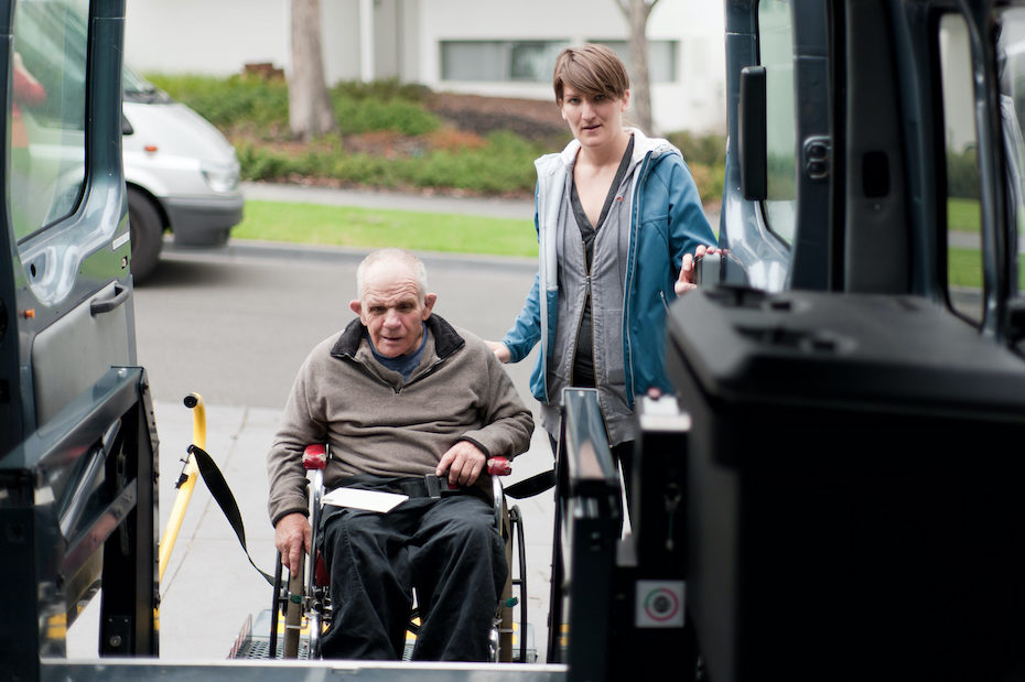 Man in wheelchair entering a modified van