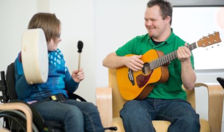 Adults with disabilities playing instruments